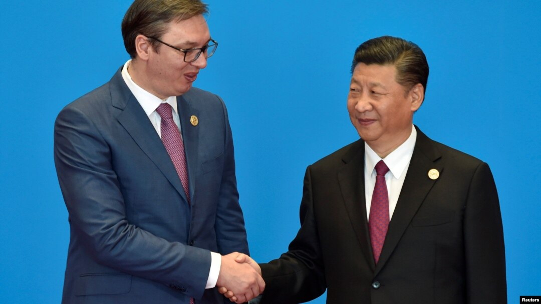 Serbian President Aleksandar Vucic (left) has sought to build a warm relationship with Chinese President Xi Jinping (file photo)