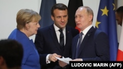 Գերմանիայի կանցլեր Անգելա Մերկել, Ֆրանսիայի նախագահ Էմանյուել Մակրոն և Ռուսաստանի նախագահ Վլադիմիր Պուտին, Փարիզ, 9-ը դեկտեմբերի, 2019թ. 