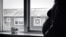 Pregnant woman standing by window