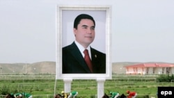 A huge portrait of President Gurbanguly Berdymukhammedov beside the horse track in Ashgabat