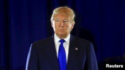 U.S. -- Republican presidential candidate Donald Trump stands as he addresses the audience at the Savannah Center in Cincinnati, Ohio, March 13, 2016