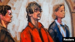 Defense attorneys Miriam Conrad (left) and Judy Clarke flank Dzhokhar Tsarnaev in court in Boston in this July 10, 2013, court sketch.