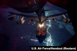 A US Air Force B-52 Stratofortress aircraft refuels from a KC-135 Stratotanker aircraft over the US Central Command area of responsibility for a mission supporting Operation Epic Fury at an undisclosed location on March 26.