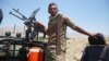 Афганский солдат охраняет блокпост после того, как силы безопасности 8 июля очистили территорию от боевиков «Талибана» в афганской провинции Лагман.