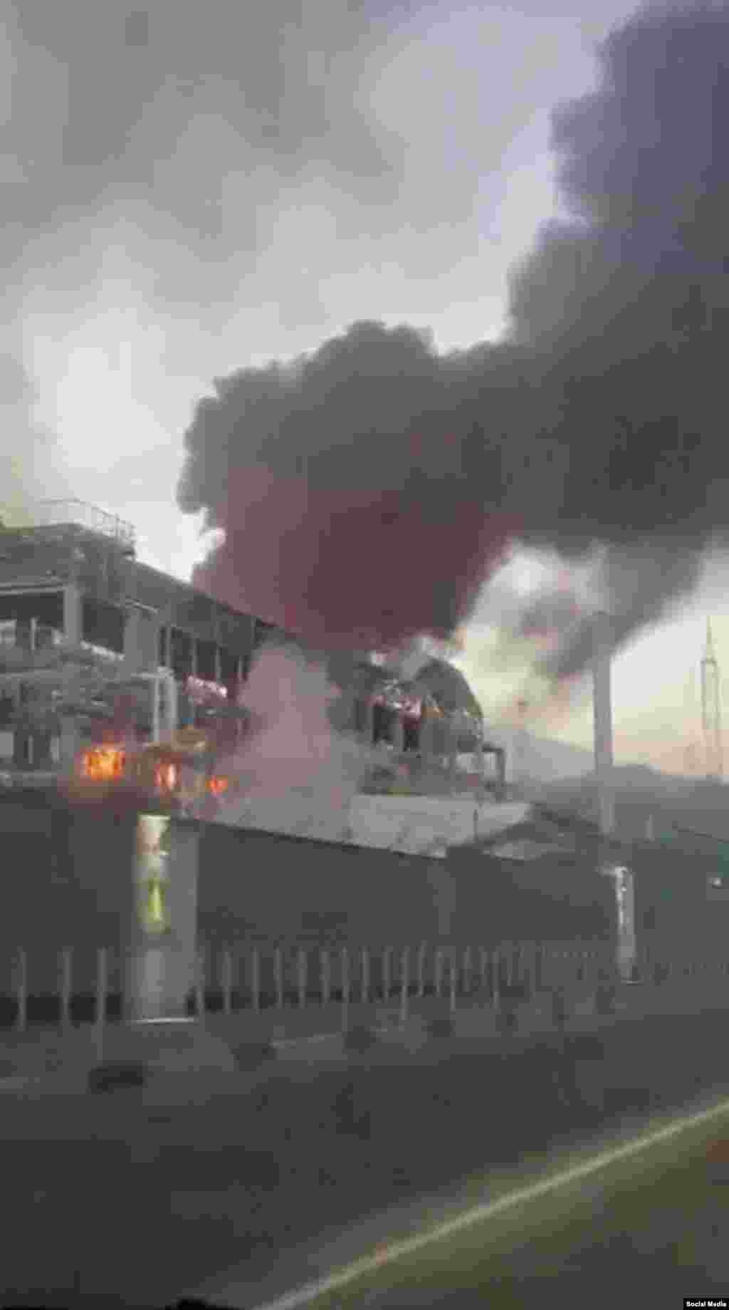 Flames seen inside a building at the Tuapse refinery on April 28.