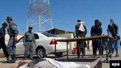 Afghanistan -- Afghan security officials inspect the