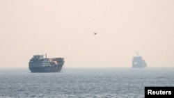 Vessels in the Strait of Hormuz, as seen from Musandam, Oman on July 8, 2026.