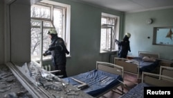 Rescuers at the maternity hospital hit by a Russian drone strike in Zaporizhzhya, Ukraine, on February 1.
