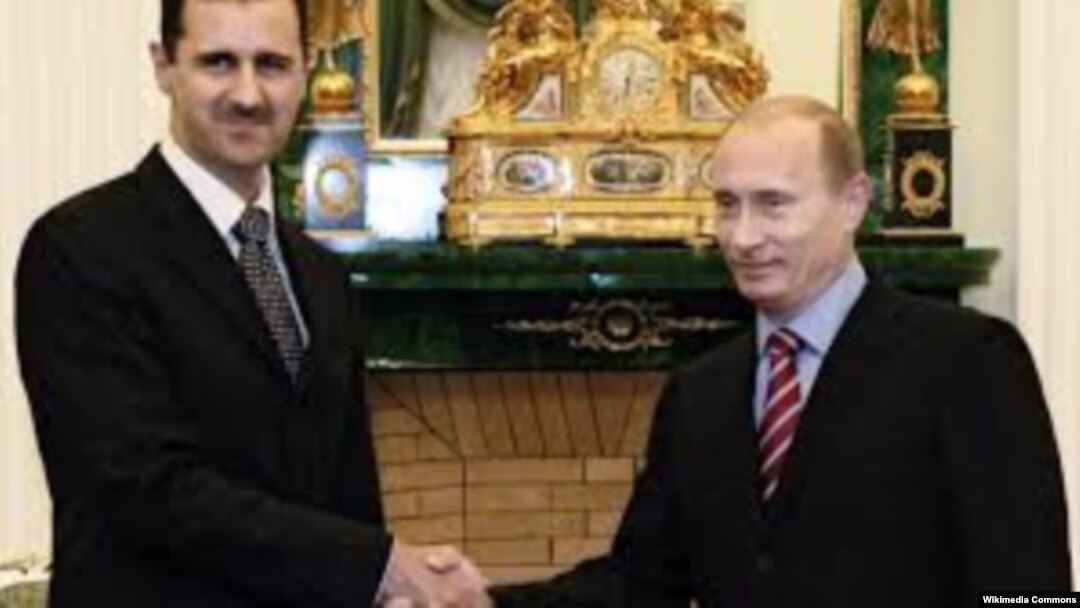 Сирийский президент Башар Асад на встрече с российским лидером Владимиром Путиным, октябрь 2015 года