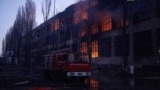 Firefighters work at the site of a Russian missile and drone strike in Ukraine's Odesa on December 13. The region is suffering major power outages after Russia's latest air attacks.