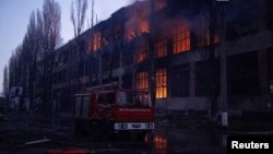Firefighters work at the site of a Russian missile and drone strike in Ukraine's Odesa on December 13.