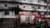 ROMANIA -- Firefighters gather in the courtyard of the Matei Bals infectious diseases hospital's burned pavilion in Bucharest, January 29, 2021
