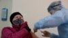 A woman receives an injection with the Sputnik-V vaccine at a hospital in Russia's Stavropol Region. 