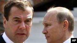 President Dmitry Medvedev (left) and Prime Minister Vladimir Putin.