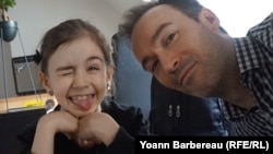 Yoann Barbereau and his daughter Eloise, in a photo taken during their first meeting upon his return to France after escaping Russian custody