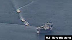 Iranian vessels take part in what what the U.S. Navy says were "unsafe and unprofessional actions against U.S. navy ships in the Persian Gulf on April 15. 