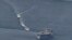 Three Revolutionary Guards vessels maneuver near a U.S. Navy ship in the Persian Gulf in April.