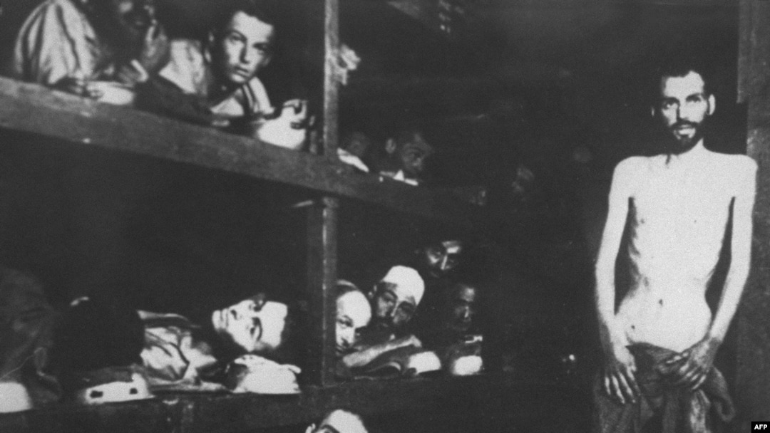 Jewish deportees in the Auschwitz concentration camp pose for a Soviet photographer when the Red Army restaged the liberation of the Nazi camp a week after they first arrived in January 1945.