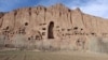 This photo shows dozens of caves and the empty alcove that once housed Solsol, a 55-meter high statue of the Buddha.