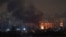 Огонь и дым после ударов российских беспилотников, Киев, Украина, 24 января 2026 года