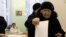 One woman casts her ballot at a polling station in Moscow