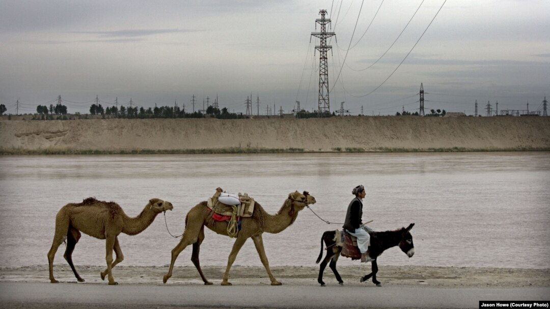 A transmission line across the Amu Darya river bringing power from Uzbekistan into Afghanistan, which is dependent on its neighbors for much of its electricity. (file photo) 
