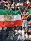 Pre-Revolutionary Flags Fly At Iran's World Cup Opener, Defying FIFA Ban