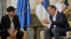 Ralph Fiennes (left) received Serbian citizenship and an ID card from President Aleksandar Vucic in Belgrade on September 24.