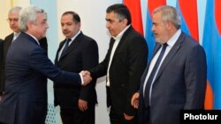 Armenia - President Serzh Sarkisian greets leaders of the Armenian Revolutionary Federation before concluding a new power-sharing agreement with them in Yerevan, 11May2017.