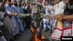 An effigy of U.S. President Barack Obama is burned during an anti-American demonstration in Hyderabad, Pakistan, in September.