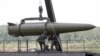 Russian servicemen equip an Iskander tactical missile system in Kubinka, outside Moscow.