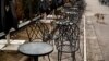 Empty chairs outside a bar amid the coronavirus pandemic in Pristina on April 3.