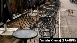 Empty chairs outside a bar amid the coronavirus pandemic in Pristina on April 3.