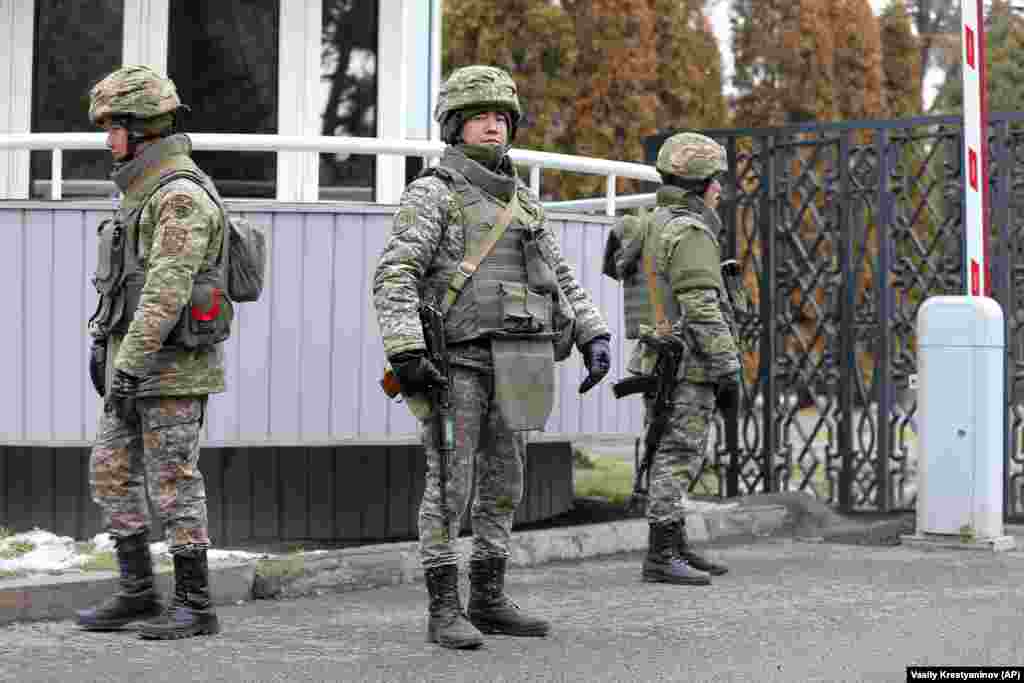 Kazakh troops guard an airport outside Almaty on January 11.&nbsp;