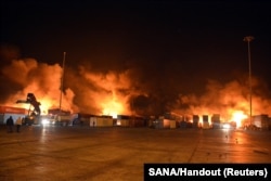 Smoke rises at what Syrian state media said was an Israeli missile attack in a container storage area at the Syrian port of Latakia in December 2021.