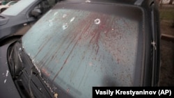 A bullet-riddled and blood-stained windscreen following clashes in the central square in Almaty on January 10.