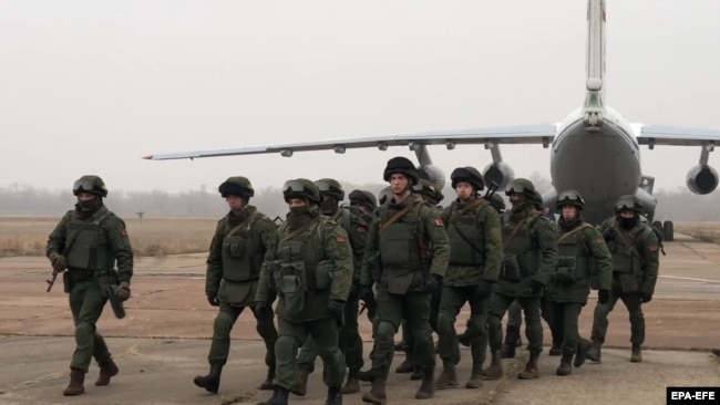 Belarusian troops arrive at an airfield in Kazakhstan as part of the CSTO mission on January 8.