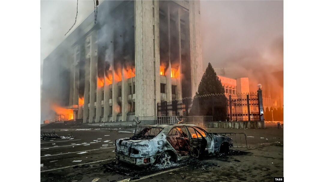 A car burns outside the Almaty mayor’s office following protests on January 5, 2022.