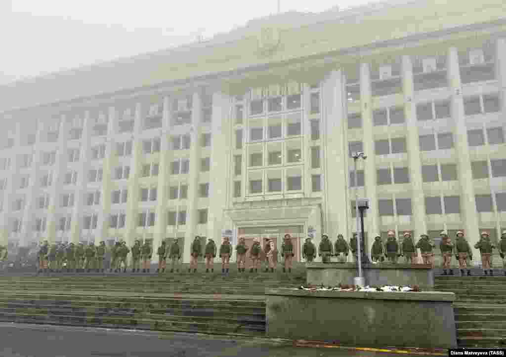 A line of Kazakh security forces in front of a government building in Almaty on January 5.