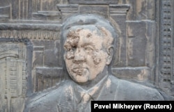 A detail of a public monument in Almaty depicting Kazakhstan's first president, Nursultan Nazarbaev, which was smeared with mud during the recent protests.
