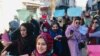 Afghan women protest on January 11 against the Taliban's decree of mandatory hijab.