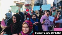 Afghan women protest on January 11 against the Taliban's decree of mandatory hijab.
