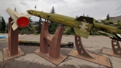 Mockups of domestically made Iranian missiles are displayed at an exhibition outside the Defense Museum in Tehran on March 31.