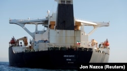 An Iranian flag flies on the Adrian Darya 1 as it sat anchored in the Strait of Gibraltar on August 18.