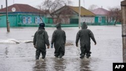 Kazakh rescue workers seek to evacuate residents from the flooded settlement of Pokrovka in northern Kazakhstan, close to the border with Russia, a region that has been badly affected by floods in recent weeks. 