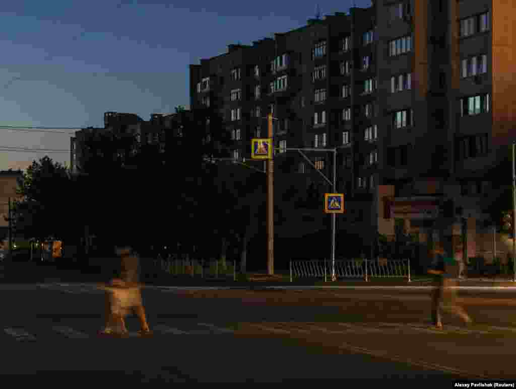 People seen in Yevpatoria on July 5.The Krimenergo statement lists 19 cities and settlements throughout the peninsula that remained without power on July 7.