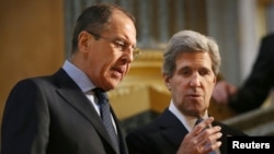 Russian Foreign Minister Sergei Lavrov (left) with U.S. Secretary of State John Kerry during the G8 Foreign Ministers Meeting in London on April 11.