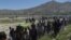 Mourners carry the coffin of one of the 150 victims killed in Kabul on May 31.