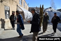 Armed Hazara militia members prepare to patrol against Taliban insurgents in Maidan Wardak Province. The Hazaras are a Shi'ite minority in Afghanistan frequently targeted by Islamic State extremists as well as the Taliban.