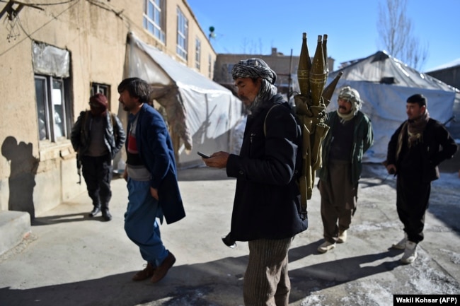 Armed Hazara militia members prepare to patrol against Taliban insurgents in Maidan Wardak Province. Hazara are a Shi'ite minority in Afghanistan frequently targeted by Islamic State extremists as well as the Taliban.